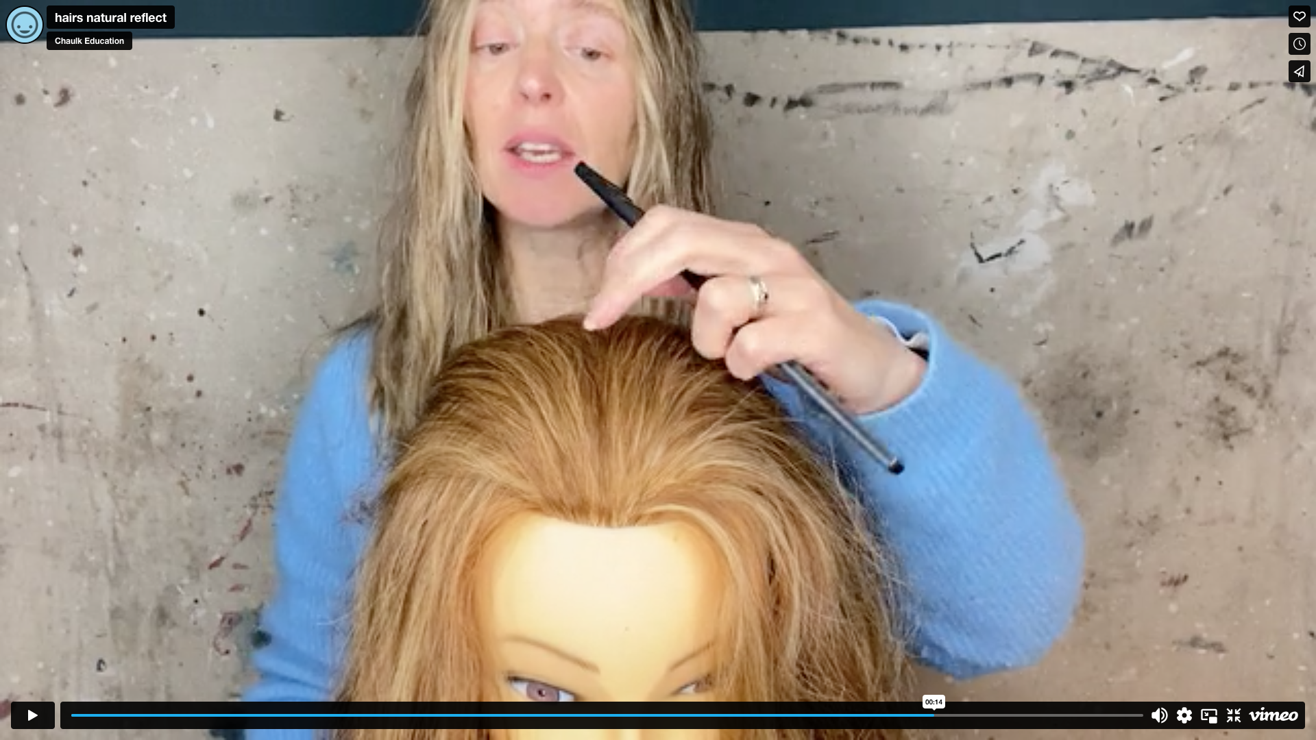 Still from video of Sarah Spiers demonstrating hair colouring